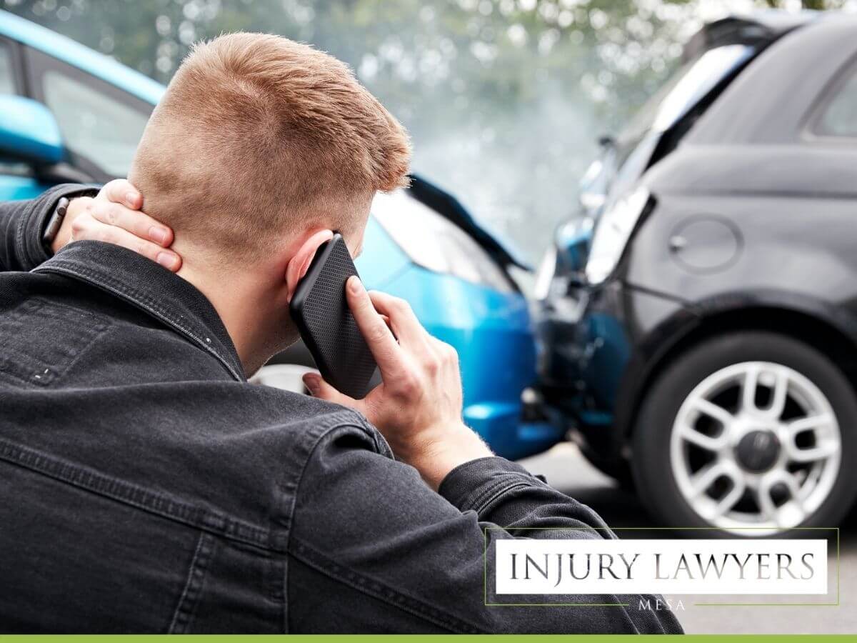 Young male involved in car accident, calling accident attorneys in Mesa, AZ